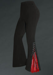 Black bell-bottom pants with lace-up side details and red two-tone flare – stretchy gothic flare pants for rock 'n' roll, retro, and alternative fashion.