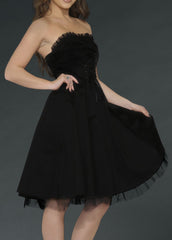 Dark and romantic strapless black dress with corset lacing, a gothic swing silhouette, and vintage-inspired details for Lolita, steampunk, or edgy fashion